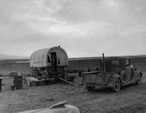 Image of Camp of dryland Mormon farmer. He lives in Snowville, Utah, and is farming land in Oneida County, Idaho, which he has leased from the Mormon church. Camp is in Oneida County, Idaho