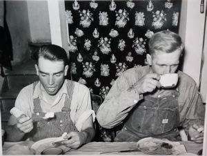 Image of Mormon farmers eating dinner. Box Elder County, Utah