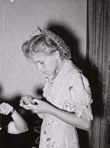 Image of Mormon girl threading a needle. Snowville, Utah