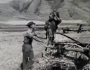 Image of Neighboring farmer asking one of the members of the Olsen cooperative binder when custom work could be done for him. Mantua, Utah