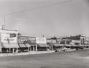Image of Main street of Brigham, Utah. In the small shopping centers in the Mormon communities the business establishments are likely to be many small ones rather than one large company dominating