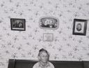 Image of Old resident of Santa Clara, Utah, with pictures of some of her foreears. 